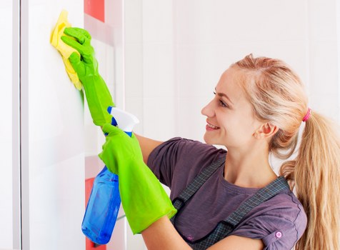 Window cleaner working on a residential property in W4