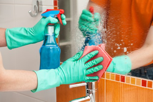 Local oven cleaner working in a West London kitchen