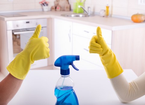 Cleaner managing hoses and wet-floor safety measures