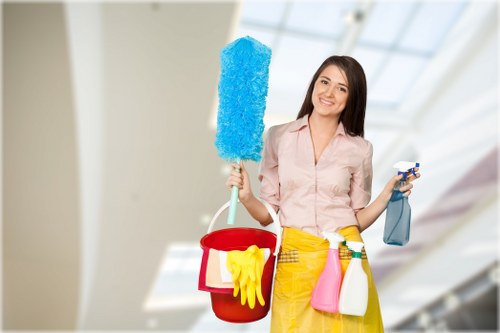 Local cleaner vacuuming and dusting a flat in W4