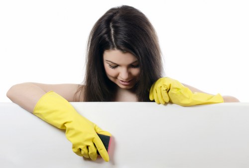 Technician treating stains on a hallway carpet in W4